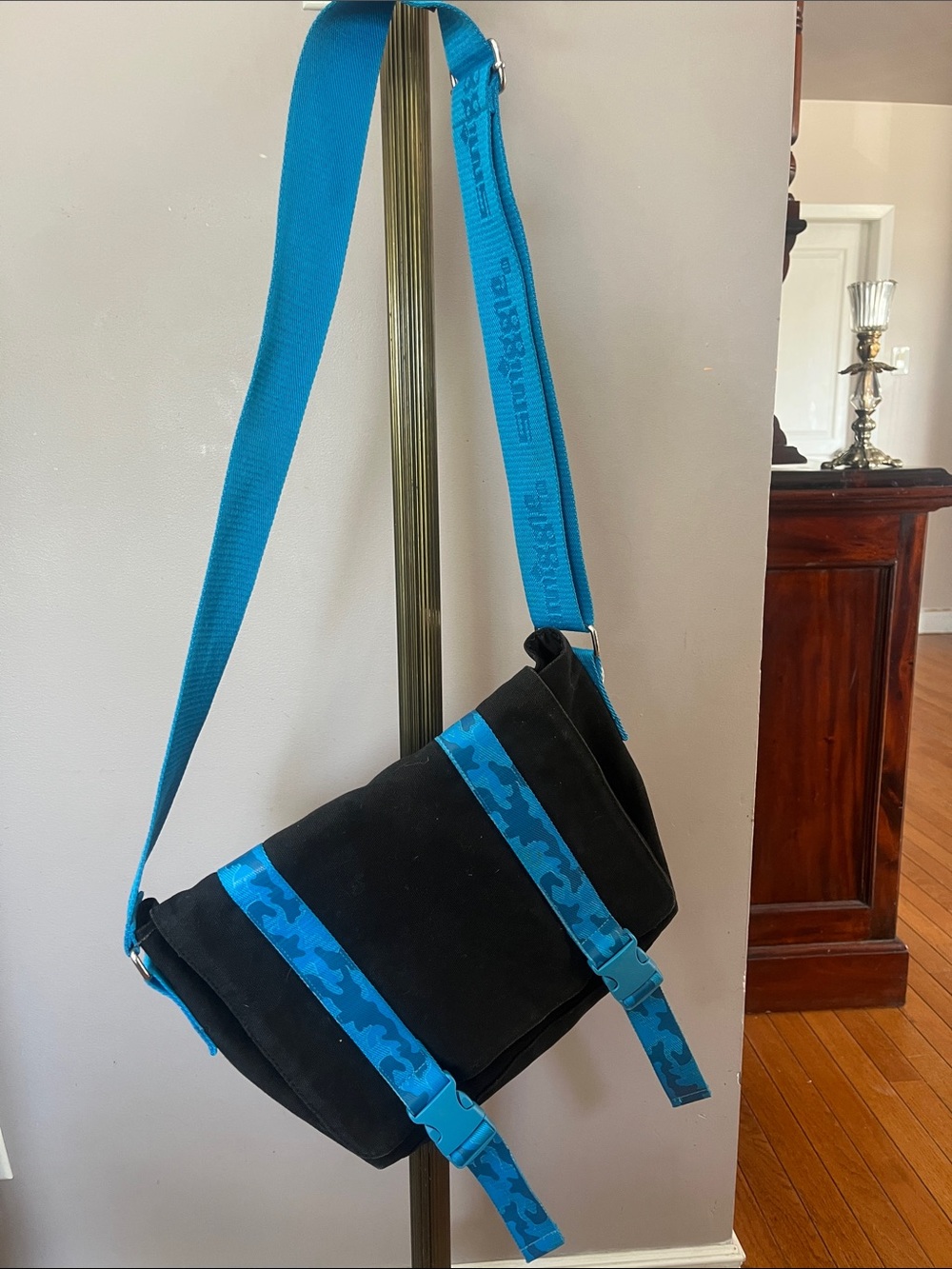 Black Messenger Bag with Blue Camouflage Strap Accents